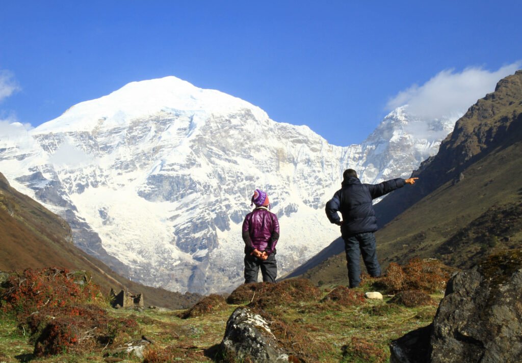 Trekkers beneath snow-capped Himalayan peaks in Bhutan