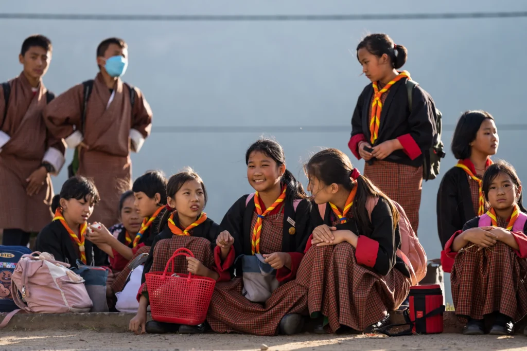 Bhutanese children in traditional dress sitting together