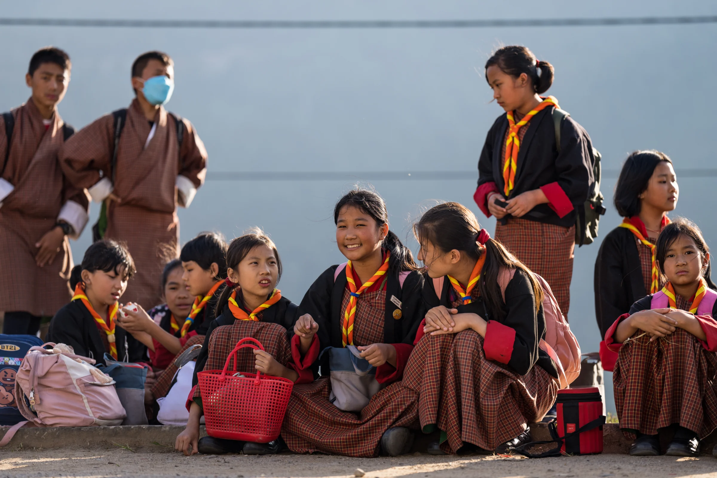 Bhutanese children in traditional dress sitting together